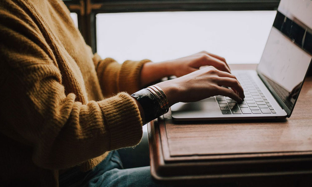 Photo of person accessing gambling addiction support on a laptop