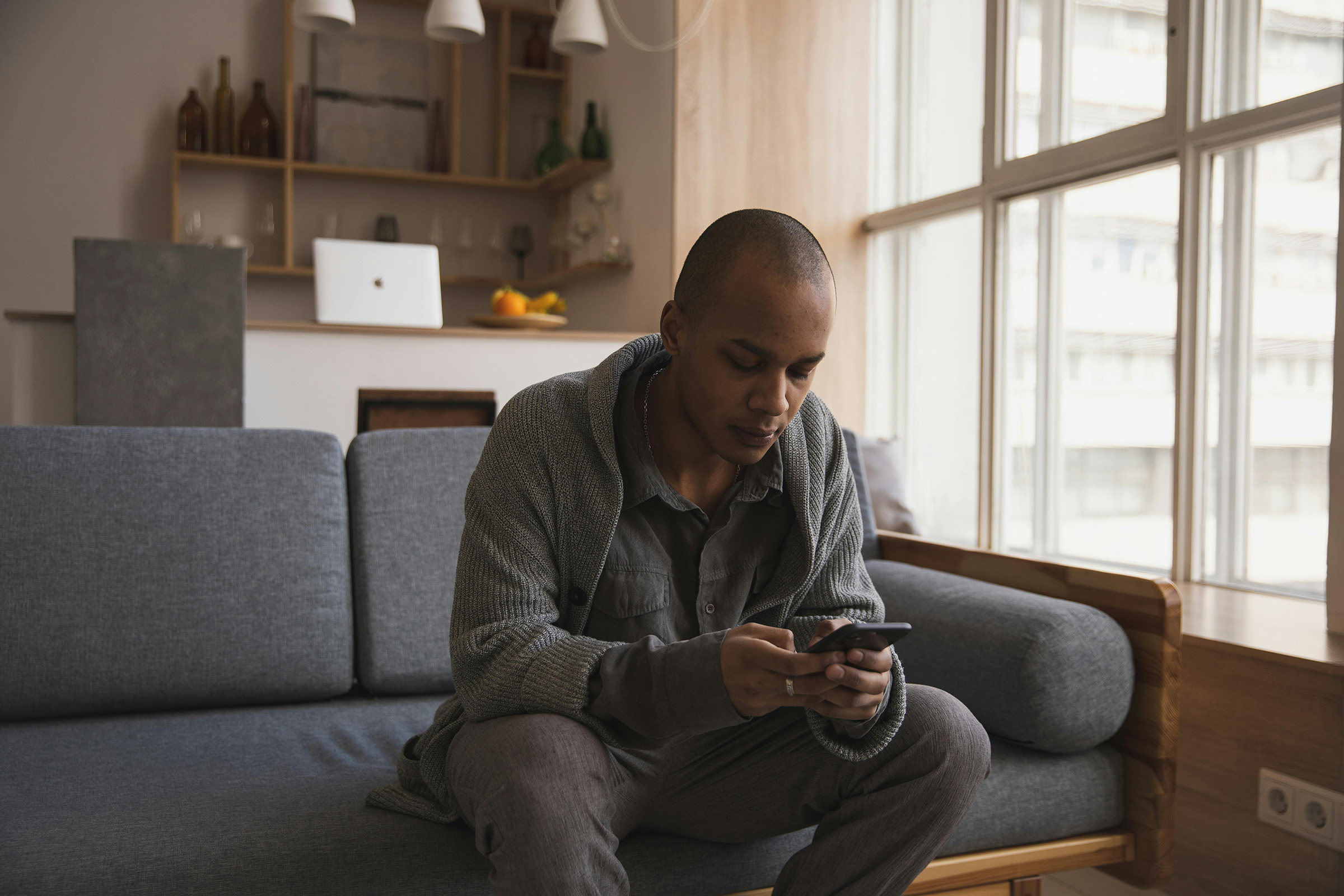 Man completing a physical activity behavioural change triage at home