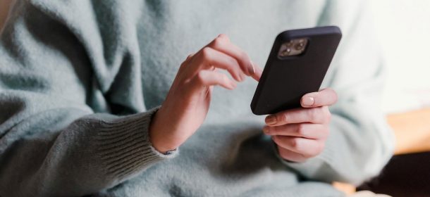 Client Using Mobile Device To Access The Client Portal Aspect Ratio 610 280