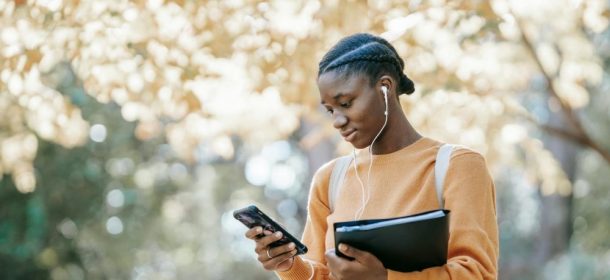 Woman Using Mobile Phone In Outdoor Setting Aspect Ratio 1000 600 Aspect Ratio 610 280