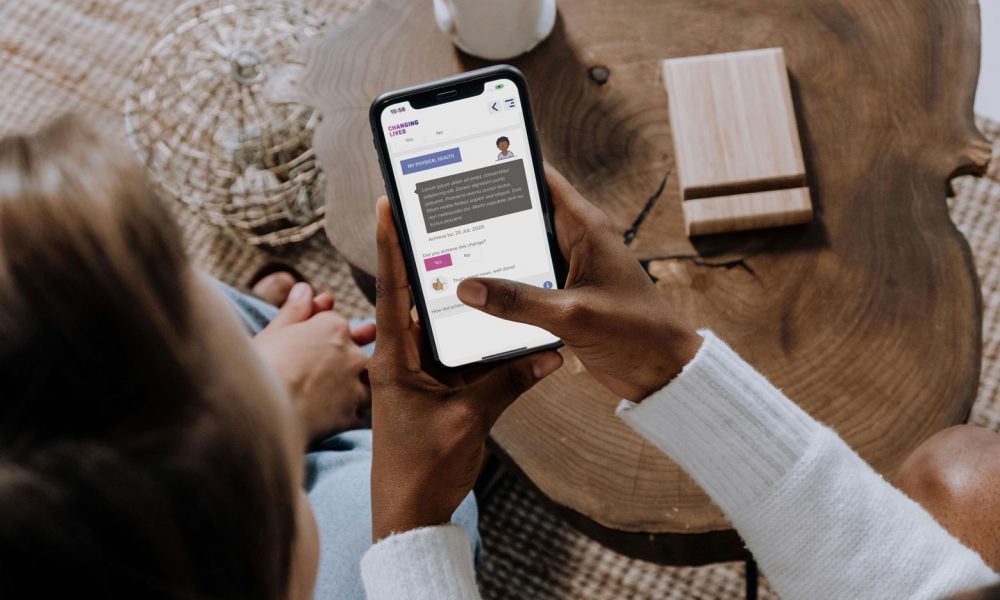 2 People Reviewing Client Portal On Mobile Device Aspect Ratio 1000 600