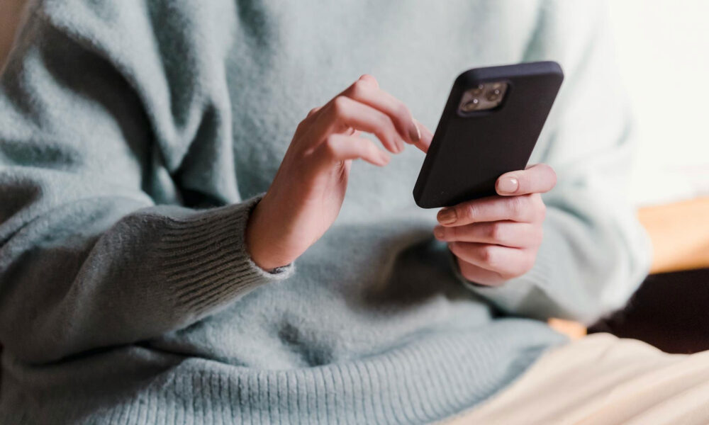 Client Using Mobile Device To Access The Client Portal Aspect Ratio 1000 600